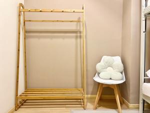 a room with a chair and a mirror at Perling Muji 3 Bedrooms Suites 6 pax Paradigm Mall in Johor Bahru