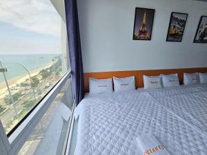 Postel nebo postele na pokoji v ubytování ZoZo House - Homestay Bai Sau - bien Vung Tau