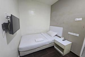 Postel nebo postele na pokoji v ubytování Fast Hotel Sri Gombak