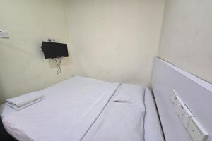 Postel nebo postele na pokoji v ubytování Fast Hotel Sri Gombak