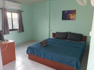 Ένα ή περισσότερα κρεβάτια σε δωμάτιο στο Rawai-Casevacanze