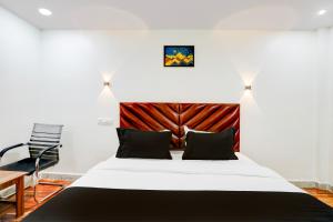 Postel nebo postele na pokoji v ubytování HOTEL O RMS GRAND