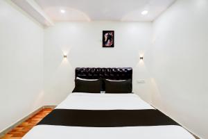 Postel nebo postele na pokoji v ubytování HOTEL O RMS GRAND