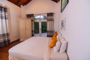 Postel nebo postele na pokoji v ubytování Chaminrich villa + 37 fotografií