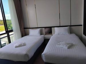 View khong Hotel โรงแรมวิวโขง客房内的一张或多张床位