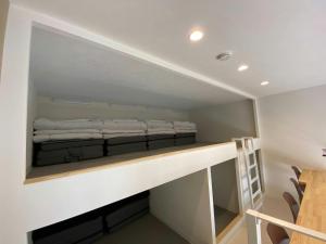 a room with a bed on a shelf at The land hotel L6 in Arao