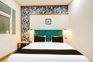 Postel nebo postele na pokoji v ubytování Super Townhouse Hotel Silver Saffron