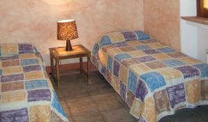 Letto o letti in una camera di Agriturismo QuartoPodere