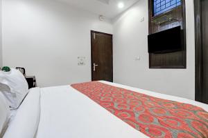 Postel nebo postele na pokoji v ubytování New Ammby Inn - Lajpat Nagar