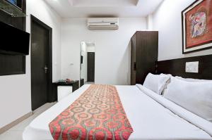 Postel nebo postele na pokoji v ubytování New Ammby Inn - Lajpat Nagar