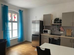 Kuchyň nebo kuchyňský kout v ubytování Ferienapartment PASSAUER WOLF im Zentrum, klimatisiert