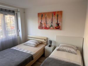 Posteľ alebo postele v izbe v ubytovaní Apartment Ella Mare