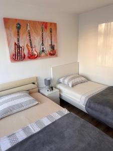 Posteľ alebo postele v izbe v ubytovaní Apartment Ella Mare + 15 fotografií