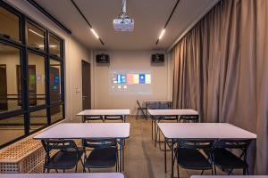 a room with tables and chairs and a window at Dreamspace Villa I Afamosa Melaka in Kampong Pulau Sebang +42 photos