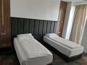 Postel nebo postele na pokoji v ubytování Hotel Sydney