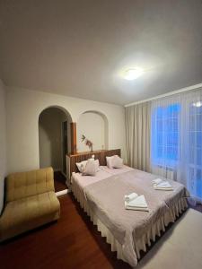 Postel nebo postele na pokoji v ubytování Zasheva Kushta Guesthouse