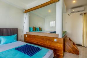 Postel nebo postele na pokoji v ubytování Peacock Beach Hotel Unawatuna