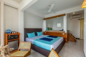 Postel nebo postele na pokoji v ubytování Peacock Beach Hotel Unawatuna