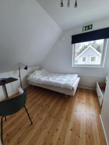 Postel nebo postele na pokoji v ubytování 7 sovrum 8 bäddar 9 sovplatser