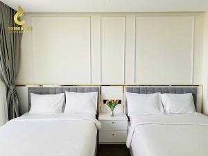 Wins House - Suite Panorama Grand客房内的一张或多张床位