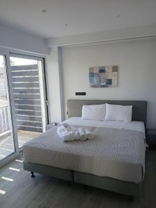 Ένα ή περισσότερα κρεβάτια σε δωμάτιο στο Utopia Suit +46 φωτογραφίες