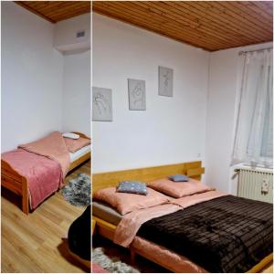 a bedroom with two beds and a window at Ferienwohnung Altes Schulhaus Walberngrün in Grafengehaig