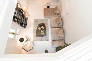 an overhead view of a living room with a couch at Plaka Villa with Epic Acropolis Views in Athens