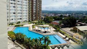 an overhead view of a swimming pool in a building at Namco City Suite in Cagayan de Oro