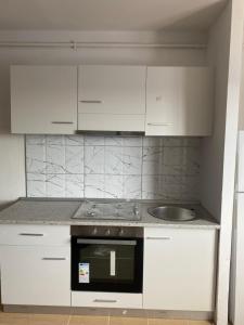 Kuchyň nebo kuchyňský kout v ubytování Sofia apartament + 7 fotografií