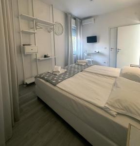 Postel nebo postele na pokoji v ubytování Albergo del Pozzo