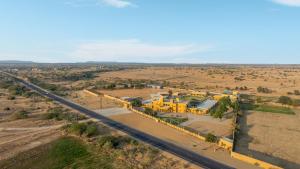 an aerial view of a large yellow building next to a road at Sterling Rudraksh Jaisalmer in Jaisalmer