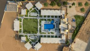 an aerial view of a house with a pool at Sterling Rudraksh Jaisalmer in Jaisalmer