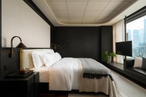 Postel nebo postele na pokoji v ubytování Chongqing Wuyu Shanxing Hotel