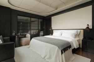 Postel nebo postele na pokoji v ubytování Chongqing Wuyu Shanxing Hotel