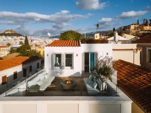 a white house with a view of a city at Plaka Villa with Epic Acropolis Views in Athens