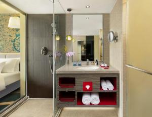 a bathroom with a sink and a shower at Radisson Collection Hyland Shanghai in Shanghai