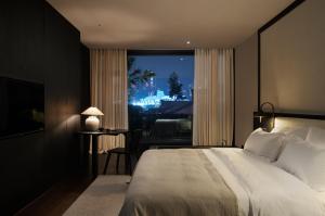 Postel nebo postele na pokoji v ubytování Chongqing Wuyu Shanxing Hotel