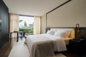 Postel nebo postele na pokoji v ubytování Chongqing Wuyu Shanxing Hotel