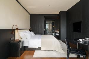 Postel nebo postele na pokoji v ubytování Chongqing Wuyu Shanxing Hotel