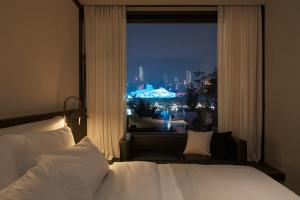 Postel nebo postele na pokoji v ubytování Chongqing Wuyu Shanxing Hotel