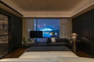 Postel nebo postele na pokoji v ubytování Chongqing Wuyu Shanxing Hotel