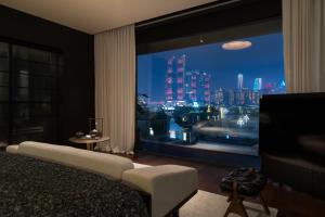 Postel nebo postele na pokoji v ubytování Chongqing Wuyu Shanxing Hotel