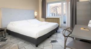 Postel nebo postele na pokoji v ubytování Hotel Delle Rose + 37 fotografií