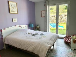 Ένα ή περισσότερα κρεβάτια σε δωμάτιο στο Pretty air conditioned villa +7 φωτογραφίες