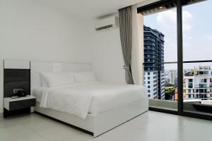 Postel nebo postele na pokoji v ubytování Noden Hotel & Apartment + 37 fotografií