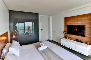 Ένα ή περισσότερα κρεβάτια σε δωμάτιο στο Villa Royale 1011 Sheffield Beach +26 φωτογραφίες