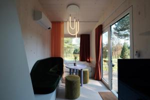 a room with a table and a chair and a window at kleiner Heidesee in Versmold