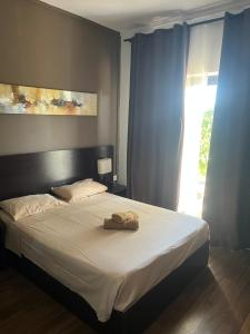 a bed with a towel on it in a bedroom at Le Binome in Grand-Baie +62 photos
