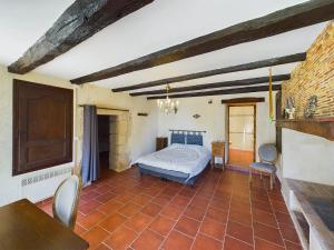 a bedroom with a bed and a table and chairs at Séjour authentique-Piscine Privée Chauffée- Spa et Nature in Beauville +34 photos