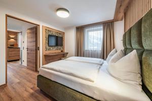 Łóżko lub łóżka w pokoju w obiekcie Montana Apartments